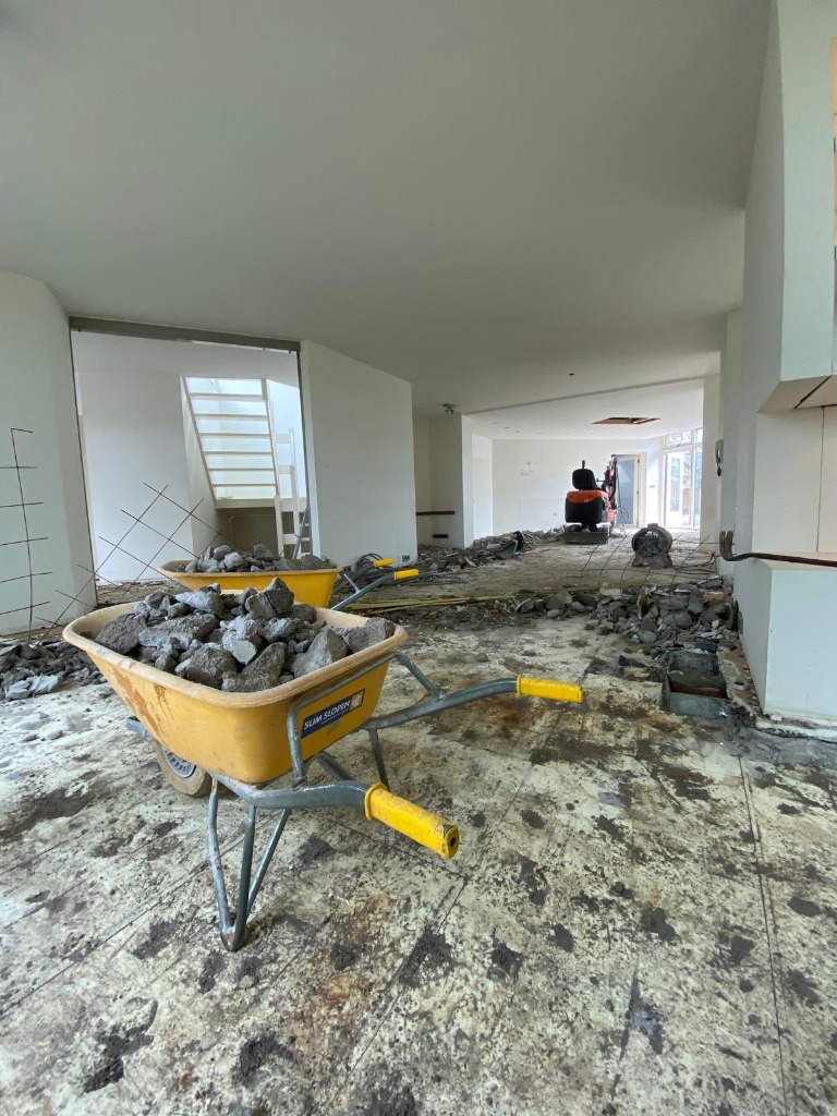 Active interior demolition site with workers