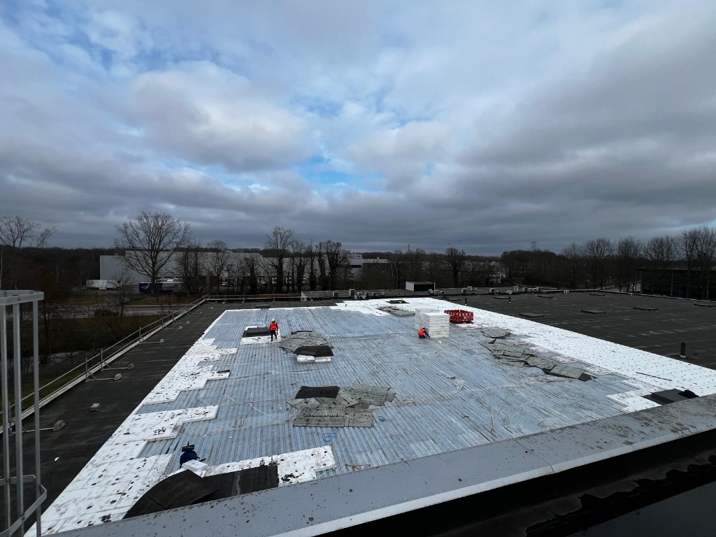 Roof demolition team in action
